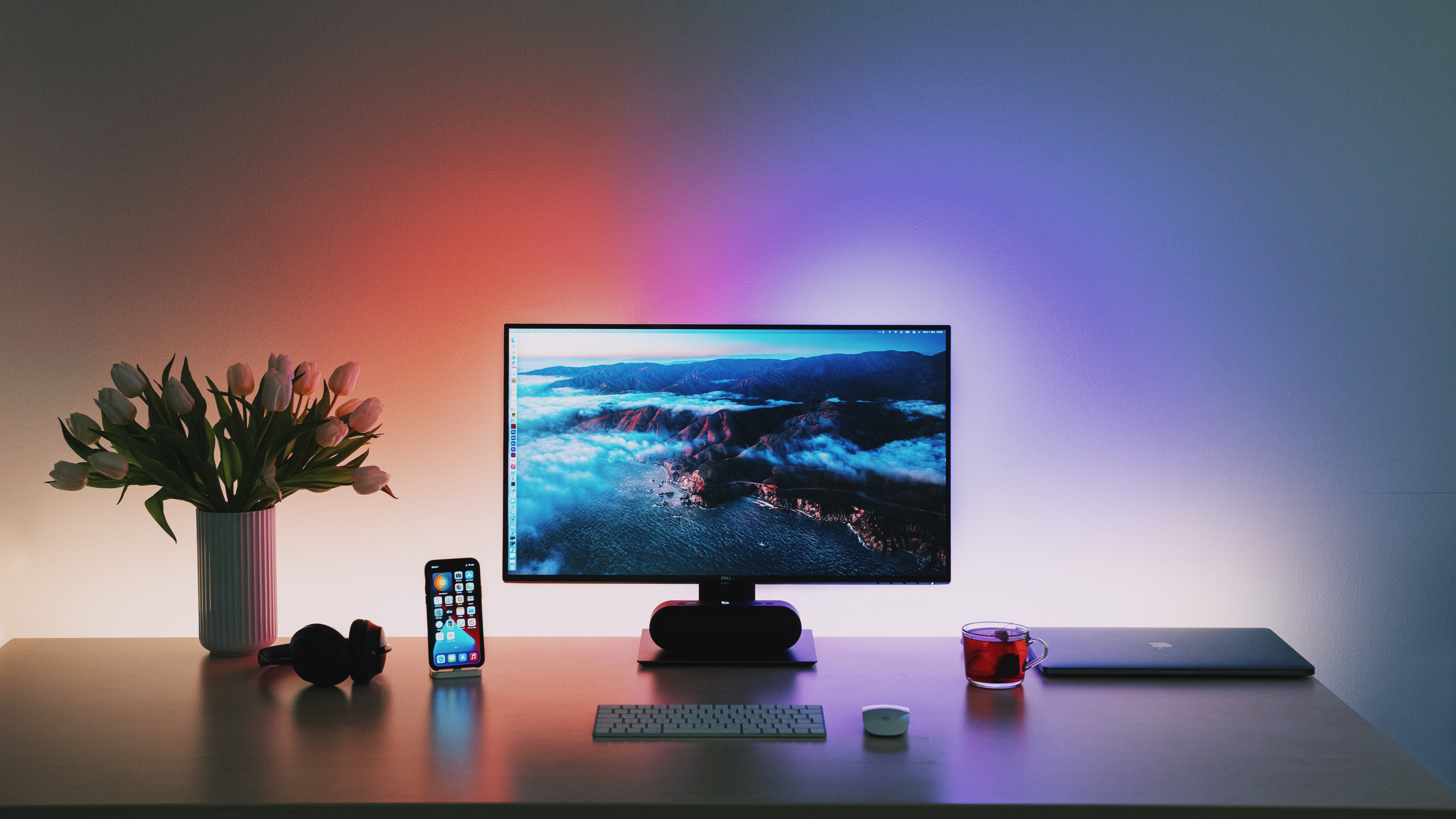 New equipment and home office set-up provided to new hires, including iMac, Magic Keyboard, Magic Mouse, and iPhone